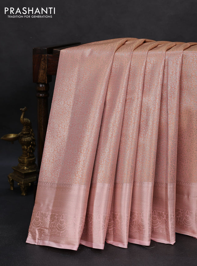 Semi kanchipuram tissue silk saree mild peach orange with allover silver zari woven brocade weaves and zari woven border