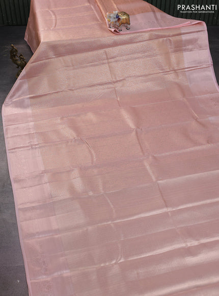 Semi kanchipuram tissue silk saree mild peach orange with allover silver zari woven brocade weaves and zari woven border