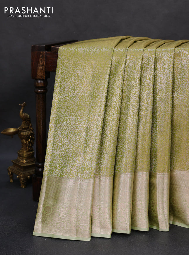 Semi kanchipuram tissue silk saree pista green with allover silver zari woven brocade weaves and zari woven border