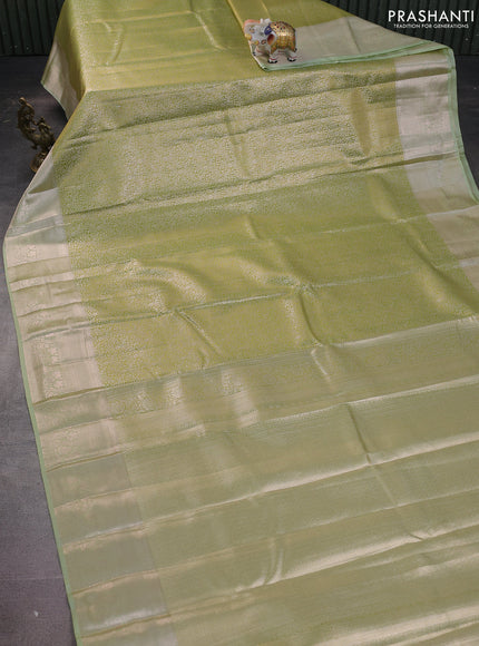 Semi kanchipuram tissue silk saree pista green with allover silver zari woven brocade weaves and zari woven border