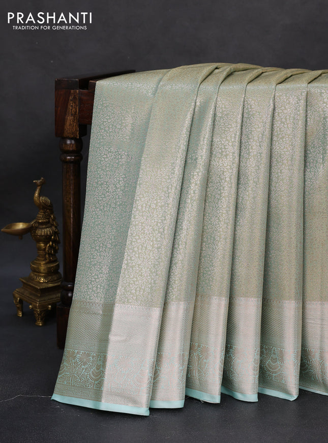 Semi kanchipuram tissue silk saree teal with allover silver zari woven brocade weaves and zari woven border