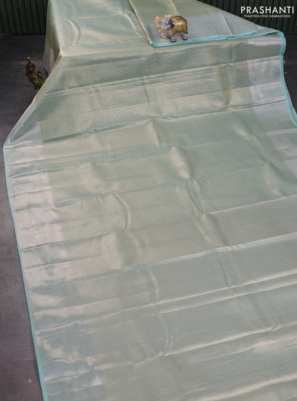 Semi kanchipuram tissue silk saree teal with allover silver zari woven brocade weaves and zari woven border