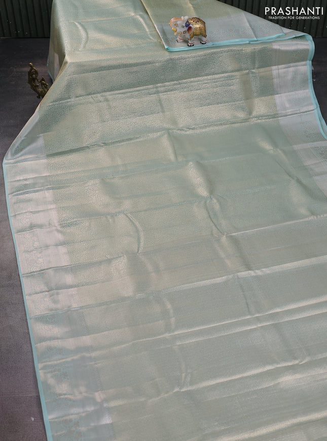 Semi kanchipuram tissue silk saree teal with allover silver zari woven brocade weaves and zari woven border