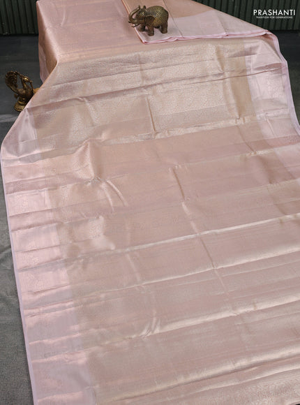 Semi kanchipuram tissue silk saree pastel peach with allover silver zari woven brocade weaves and zari woven border