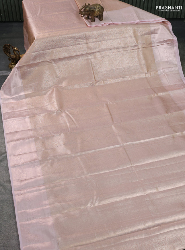 Semi kanchipuram tissue silk saree pastel peach with allover silver zari woven brocade weaves and zari woven border
