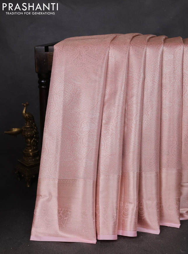 Semi kanchipuram tissue silk saree peach shade with allover silver zari woven brocade weaves and zari woven border