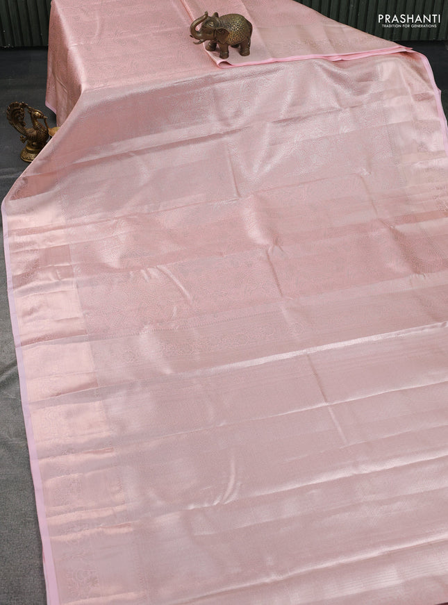 Semi kanchipuram tissue silk saree peach shade with allover silver zari woven brocade weaves and zari woven border