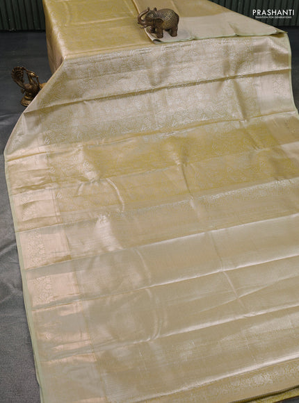Semi kanchipuram tissue silk saree lime yellow with allover silver zari woven brocade weaves and zari woven border