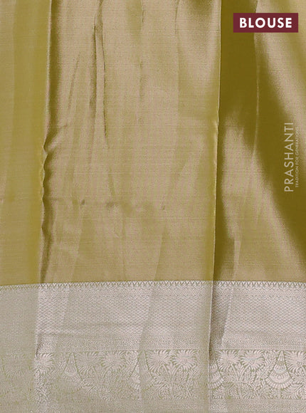 Semi kanchipuram tissue silk saree lime yellow with allover silver zari woven brocade weaves and zari woven border