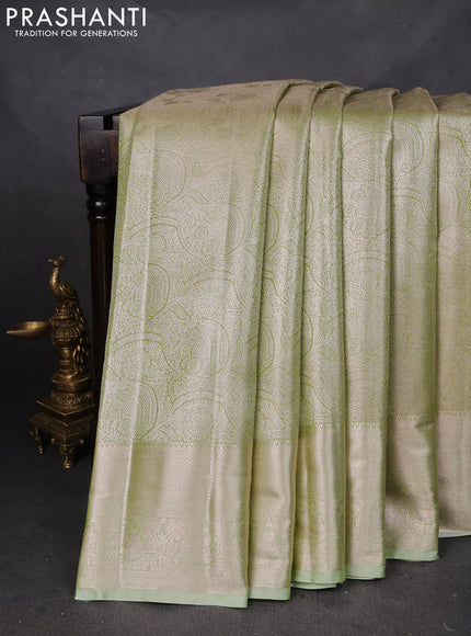 Semi kanchipuram tissue silk saree pista green with allover silver zari woven brocade weaves and zari woven border