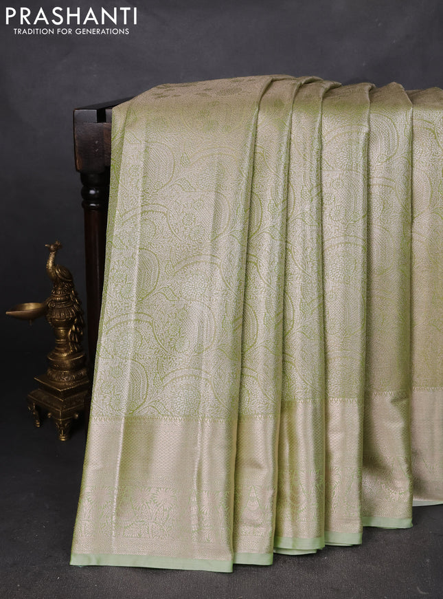 Semi kanchipuram tissue silk saree pista green with allover silver zari woven brocade weaves and zari woven border