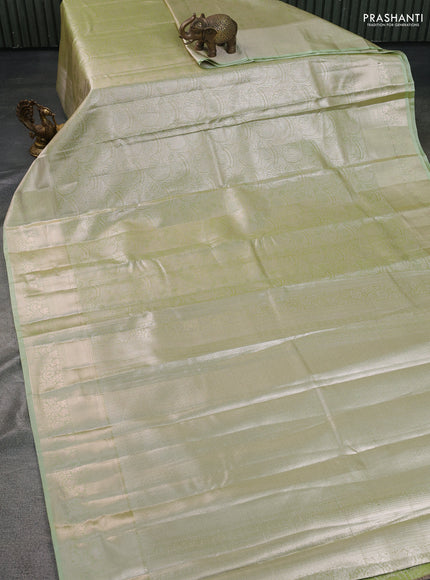 Semi kanchipuram tissue silk saree pista green with allover silver zari woven brocade weaves and zari woven border