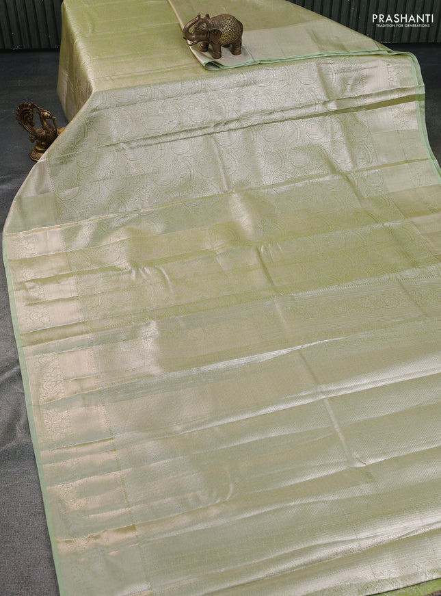 Semi kanchipuram tissue silk saree pista green with allover silver zari woven brocade weaves and zari woven border