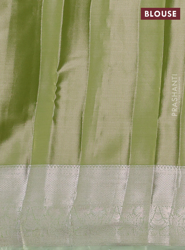 Semi kanchipuram tissue silk saree pista green with allover silver zari woven brocade weaves and zari woven border