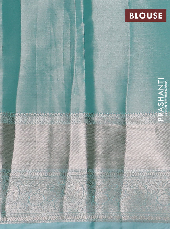 Semi kanchipuram tissue silk saree teal with allover silver zari woven brocade weaves and long zari woven border