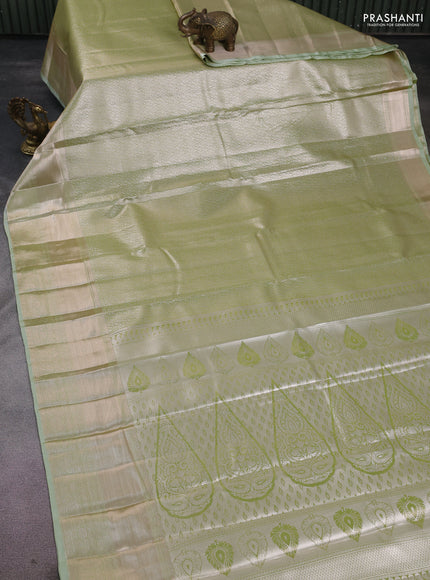 Semi kanchipuram tissue silk saree pista green with allover silver zari woven brocade weaves and long zari woven border