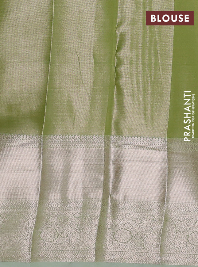 Semi kanchipuram tissue silk saree pista green with allover silver zari woven brocade weaves and long zari woven border