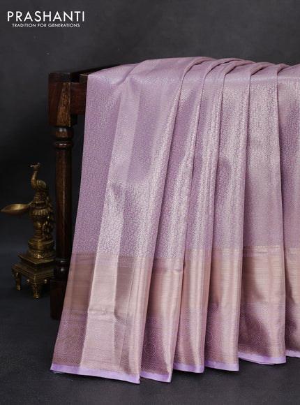 Semi kanchipuram tissue silk saree lavender with allover silver zari woven brocade weaves and long zari woven border