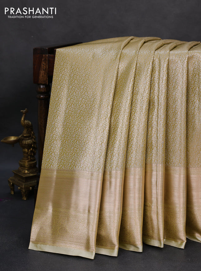 Semi kanchipuram tissue silk saree elaichi green with allover silver zari woven brocade weaves and long zari woven border