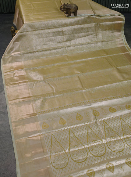 Semi kanchipuram tissue silk saree elaichi green with allover silver zari woven brocade weaves and long zari woven border