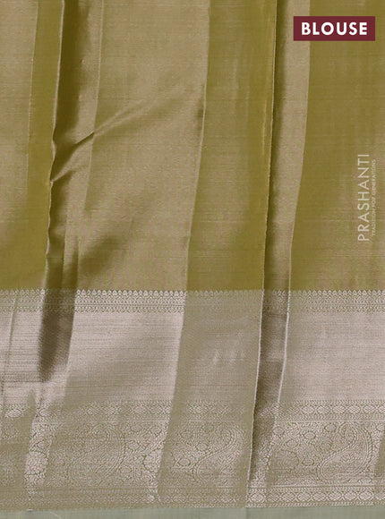 Semi kanchipuram tissue silk saree elaichi green with allover silver zari woven brocade weaves and long zari woven border