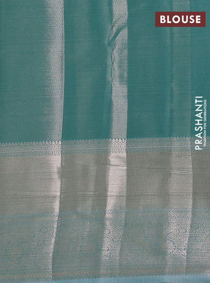 Semi kanchipuram tissue silk saree teal blue with allover silver zari woven brocade weaves and long zari woven border