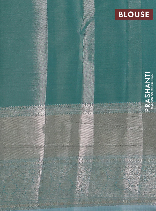 Semi kanchipuram tissue silk saree teal blue with allover silver zari woven brocade weaves and long zari woven border