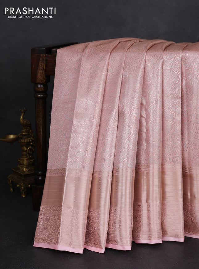 Semi kanchipuram tissue silk saree mild peach with allover silver zari woven brocade weaves and long zari woven border