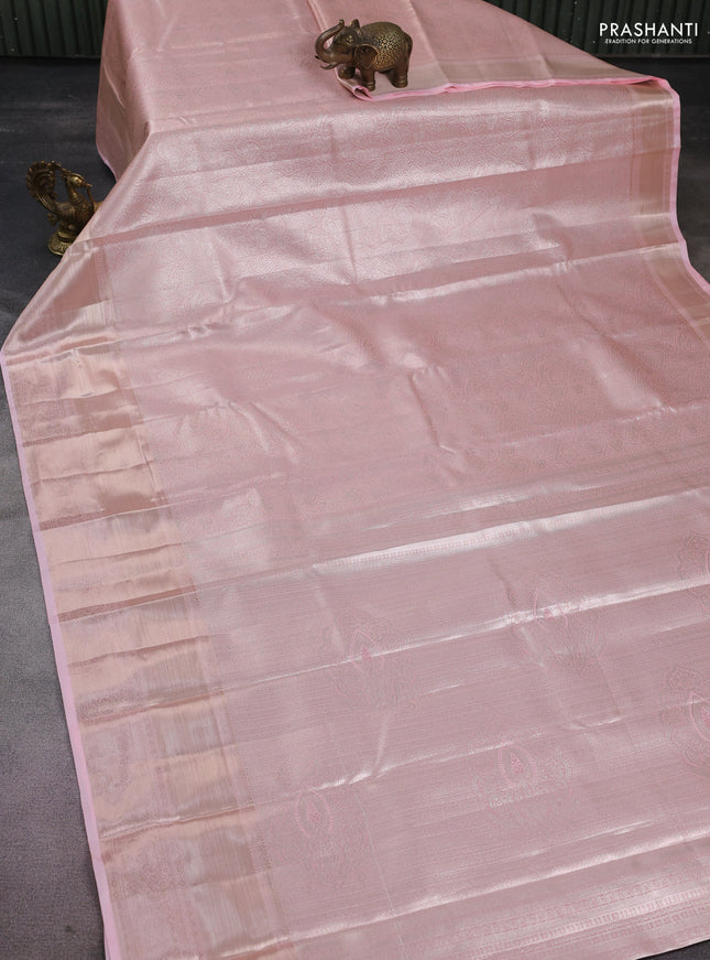 Semi kanchipuram tissue silk saree mild peach with allover silver zari woven brocade weaves and long zari woven border