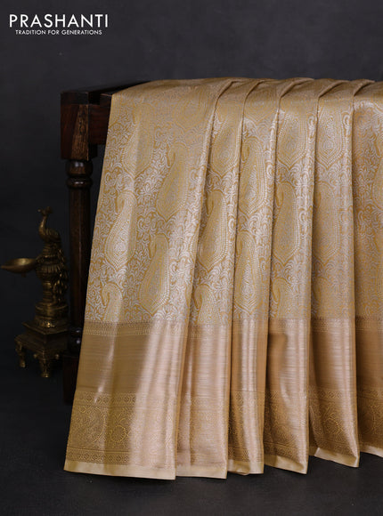 Semi kanchipuram tissue silk saree sandal with allover silver zari woven paisley brocade weaves and long zari woven border