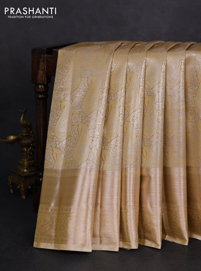 Semi kanchipuram tissue silk saree sandal with allover silver zari woven paisley brocade weaves and long zari woven border