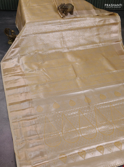 Semi kanchipuram tissue silk saree sandal with allover silver zari woven paisley brocade weaves and long zari woven border