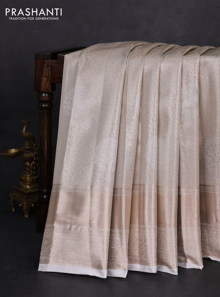 Semi kanchipuram tissue silk saree beige and off white with allover silver zari woven brocade weaves and long zari woven border