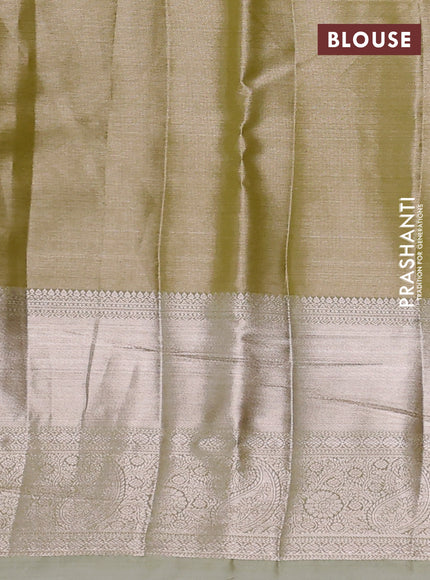 Semi kanchipuram tissue silk saree lime green and elaichi green with allover silver zari woven brocade weaves and long zari woven border