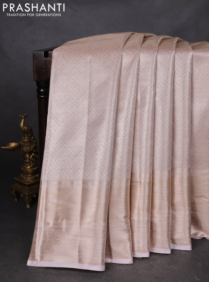 Semi kanchipuram tissue silk saree pastel peach with allover silver zari woven brocade weaves and long zari woven border