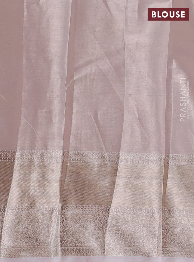 Semi kanchipuram tissue silk saree pastel peach with allover silver zari woven brocade weaves and long zari woven border