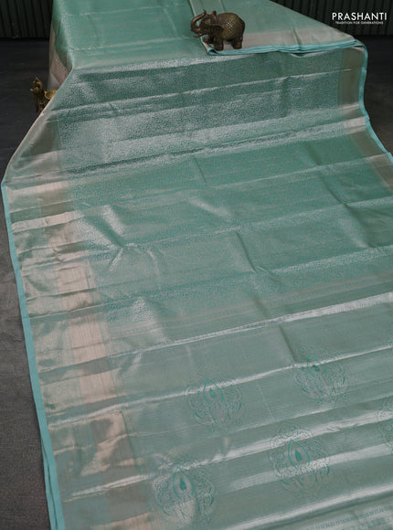Semi kanchipuram tissue silk saree teal blue with allover silver zari woven brocade weaves and long zari woven border