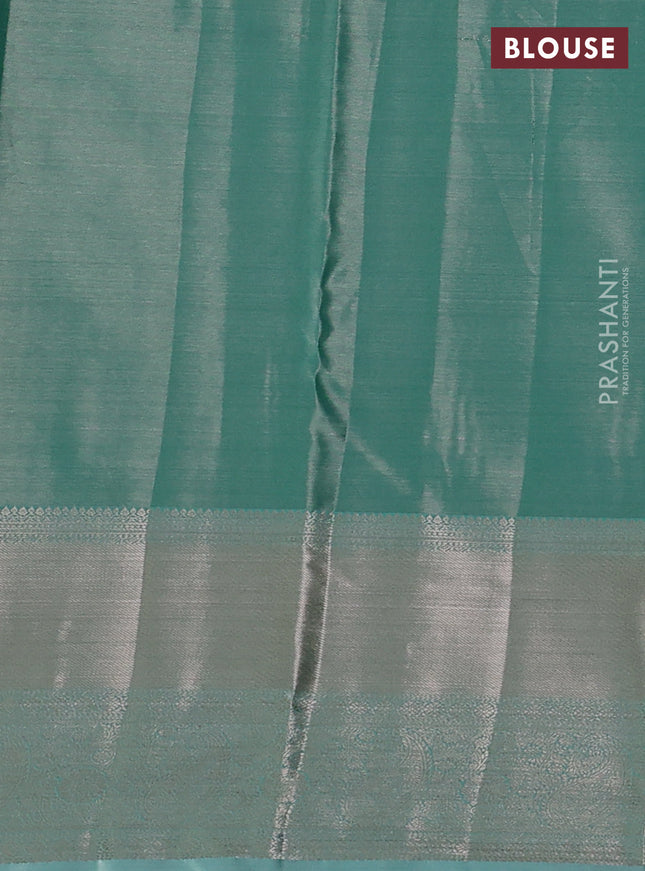 Semi kanchipuram tissue silk saree teal blue with allover silver zari woven brocade weaves and long zari woven border