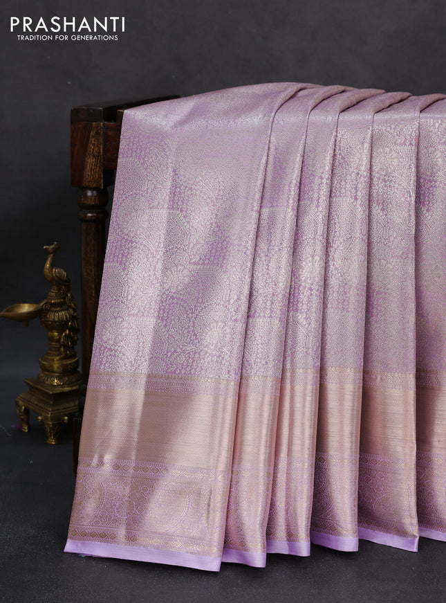 Semi kanchipuram tissue silk saree lavender with allover silver zari woven brocade weaves and long zari woven border