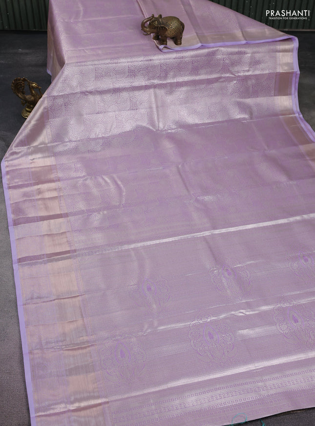 Semi kanchipuram tissue silk saree lavender with allover silver zari woven brocade weaves and long zari woven border