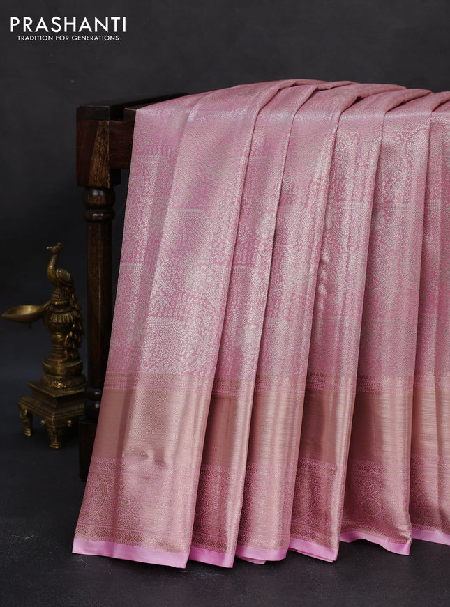 Semi kanchipuram tissue silk saree light pink with allover silver zari woven brocade weaves and long zari woven border
