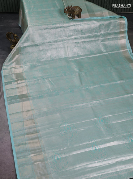 Semi kanchipuram tissue silk saree teal blue with allover silver zari woven brocade weaves and long zari woven border