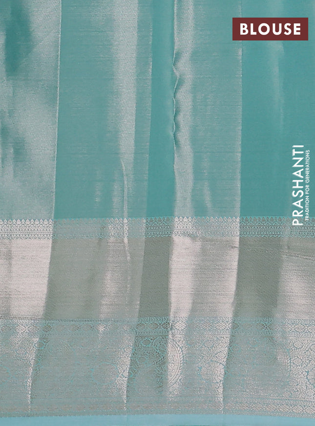 Semi kanchipuram tissue silk saree teal blue with allover silver zari woven brocade weaves and long zari woven border