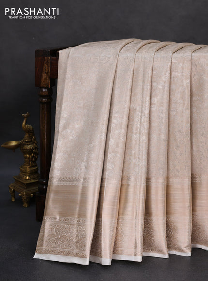 Semi kanchipuram tissue silk saree cream with allover silver zari woven brocade weaves and long zari woven border