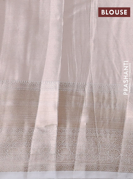 Semi kanchipuram tissue silk saree cream with allover silver zari woven brocade weaves and long zari woven border