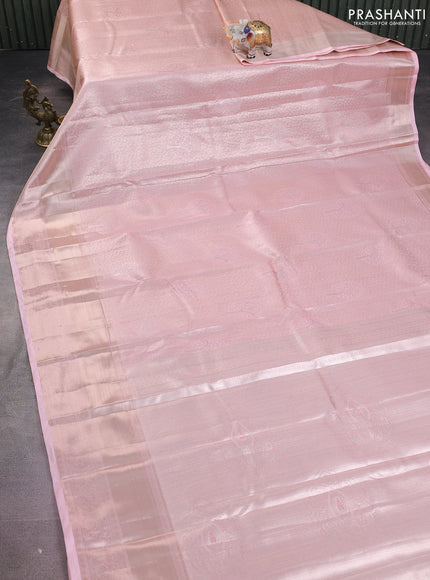 Semi kanchipuram tissue silk saree mild peach with allover silver zari woven brocade weaves and long zari woven border