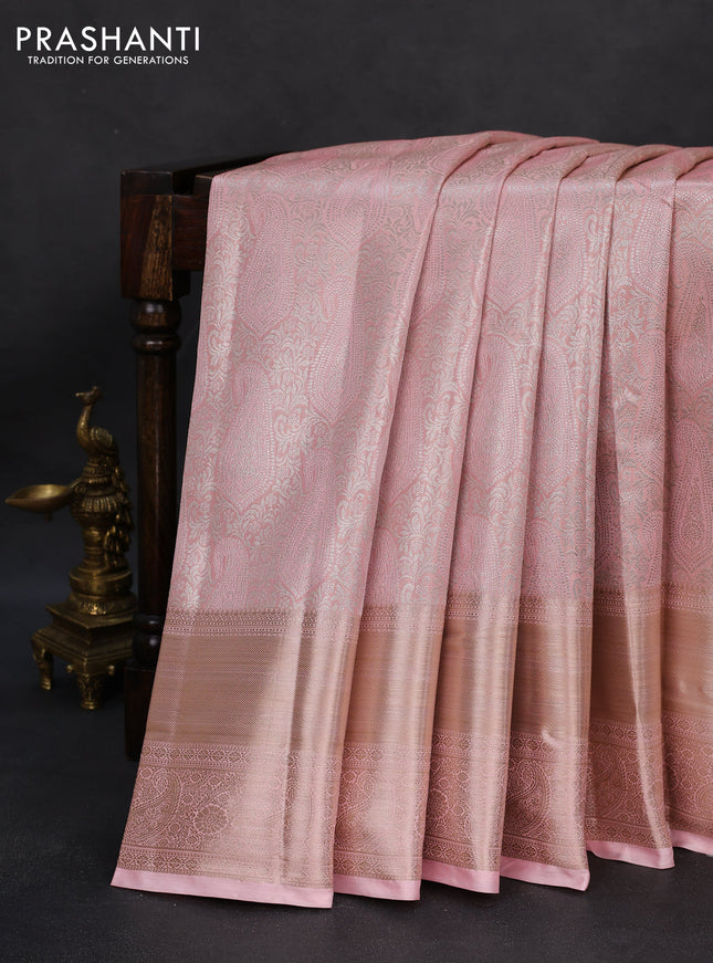 Semi kanchipuram tissue silk saree mild peach with allover silver zari woven brocade weaves and long zari woven border