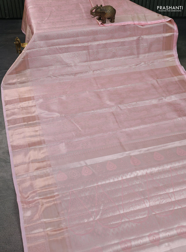 Semi kanchipuram tissue silk saree mild peach with allover silver zari woven brocade weaves and long zari woven border
