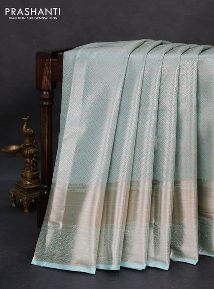 Semi kanchipuram tissue silk saree teal with allover silver zari woven brocade weaves and long zari woven border