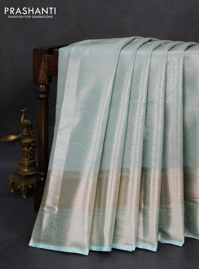 Semi kanchipuram tissue silk saree teal with allover silver zari woven brocade weaves and long zari woven border